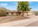 Charming single-story home with a two-car garage and mature landscaping at 4510 W North Ln, Glendale, AZ 85302