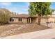 Charming single-story home with a two-car garage and mature landscaping at 4510 W North Ln, Glendale, AZ 85302
