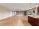 Bright open floor plan featuring tiled flooring, ceiling fan, and a kitchen counter at 4510 W North Ln, Glendale, AZ 85302