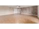 Spacious living room with tiled floor, ceiling fan, and decorative accent wall at 4510 W North Ln, Glendale, AZ 85302