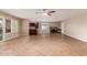 Spacious living room with tile flooring, fireplace, and neutral paint at 4510 W North Ln, Glendale, AZ 85302