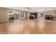 Spacious living room with tile flooring, fireplace, and sliding glass doors at 4510 W North Ln, Glendale, AZ 85302