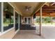Covered patio featuring a seating area with ceiling fan at 4510 W North Ln, Glendale, AZ 85302