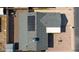 Aerial view of a home with solar panels, a well-maintained roof, and a private backyard at 4645 E Covina St, Mesa, AZ 85205