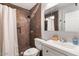 Bathroom with a tiled shower with mosaic accents, a toilet, and a modern vanity at 4645 E Covina St, Mesa, AZ 85205