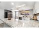 Bright kitchen featuring granite countertops, stainless steel appliances, and a large island at 4645 E Covina St, Mesa, AZ 85205