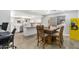 Eat-in kitchen features white cabinets, granite countertops, stainless steel appliances, and an arcade game at 4645 E Covina St, Mesa, AZ 85205