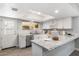 Bright kitchen featuring white cabinets, granite countertops, and stainless steel appliances at 4645 E Covina St, Mesa, AZ 85205