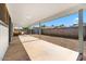 Covered patio with comfortable seating, a hammock, and access to the backyard and shed at 4645 E Covina St, Mesa, AZ 85205