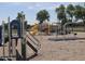A vibrant playground with climbing structures, slides, and swings for enjoyment at 4645 E Covina St, Mesa, AZ 85205