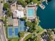 Stunning aerial view of the lake community, showcasing pool, tennis courts, and boat docks for an active lifestyle at 5200 S Lakeshore Dr # 120, Tempe, AZ 85283
