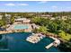 Scenic aerial view of lake community featuring a beautiful pool, lush landscaping, and boat slips at 5200 S Lakeshore Dr # 120, Tempe, AZ 85283