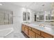 Bright bathroom with a double sink vanity, large mirror, and separate shower at 5200 S Lakeshore Dr # 120, Tempe, AZ 85283