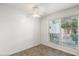 Bright bedroom with neutral tile flooring, ceiling fan and large window with blinds at 5200 S Lakeshore Dr # 120, Tempe, AZ 85283