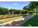 Bocce ball court with manicured landscaping and a brick-lined path, offering a relaxing outdoor activity at 5200 S Lakeshore Dr # 120, Tempe, AZ 85283