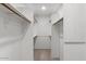 Walk-in closet with built-in shelving and ample storage space at 5200 S Lakeshore Dr # 120, Tempe, AZ 85283
