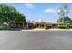 Community center exterior with covered walkways, well-maintained landscaping, and ample parking at 5200 S Lakeshore Dr # 120, Tempe, AZ 85283