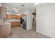Well-lit kitchen with light wood cabinets, stainless steel appliances, and tile flooring at 5200 S Lakeshore Dr # 120, Tempe, AZ 85283