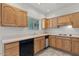 Classic kitchen featuring light wood cabinets, neutral countertops, and tile flooring at 5200 S Lakeshore Dr # 120, Tempe, AZ 85283