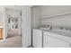 Laundry room with newer washer and dryer and shelving at 5200 S Lakeshore Dr # 120, Tempe, AZ 85283