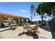 A covered outdoor dining area with a built-in grill, perfect for enjoying outdoor meals and gatherings at 5200 S Lakeshore Dr # 120, Tempe, AZ 85283