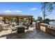 Covered outdoor kitchen and dining area with multiple grills, perfect for entertaining and enjoying outdoor meals at 5200 S Lakeshore Dr # 120, Tempe, AZ 85283