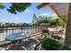 Outdoor patio with tables and chairs, overlooking a pool and a waterfront community, offering a relaxing retreat at 5200 S Lakeshore Dr # 120, Tempe, AZ 85283