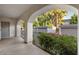 Covered patio leading to garage parking with mature plants at 5200 S Lakeshore Dr # 120, Tempe, AZ 85283