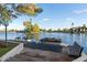 Beautiful waterfront view with two boats docked, complemented by a seating area and lush greenery at 5200 S Lakeshore Dr # 120, Tempe, AZ 85283