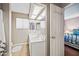 Bright bathroom featuring double sinks, tile flooring, and a well-lit vanity mirror at 5341 W Bloomfield Rd, Glendale, AZ 85304
