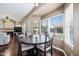 Bright dining area features a round table, wood floors and a large window view at 5341 W Bloomfield Rd, Glendale, AZ 85304