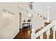 Foyer featuring hardwood floors, a staircase, and a view of another living area at 5341 W Bloomfield Rd, Glendale, AZ 85304