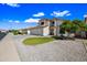 Charming two-story home with a circular grassy area and easy-to-maintain desert landscaping at 5341 W Bloomfield Rd, Glendale, AZ 85304