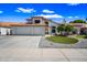 Beautiful two-story home featuring a well-maintained front yard and a three-car garage at 5341 W Bloomfield Rd, Glendale, AZ 85304