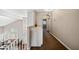 Upstairs hallway with neutral colors and views of the staircase at 5341 W Bloomfield Rd, Glendale, AZ 85304