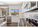 Bright kitchen featuring stainless steel appliances, granite counters, subway tile backsplash, and lots of natural light at 5341 W Bloomfield Rd, Glendale, AZ 85304