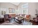 Comfortable living room featuring neutral paint, hardwood floors, and plenty of natural light at 5341 W Bloomfield Rd, Glendale, AZ 85304