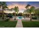 Expansive backyard features a luxurious pool, a waterfall, and lounge seating at 5630 E Peak View Rd, Cave Creek, AZ 85331