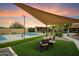 Lounge seating near a pickleball court highlights the outdoor recreation of this impressive desert property at 5630 E Peak View Rd, Cave Creek, AZ 85331