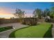 Backyard putting green and lounging area at 5630 E Peak View Rd, Cave Creek, AZ 85331