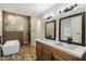Spa-like bathroom featuring a standalone tub, walk-in shower, double vanity, and elegant lighting fixtures at 5630 E Peak View Rd, Cave Creek, AZ 85331