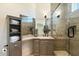 Bathroom featuring a single vanity, custom mirror, and walk-in shower with a glass door at 5630 E Peak View Rd, Cave Creek, AZ 85331