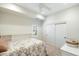 Bright bedroom features a neutral palette, ceiling fan, and sliding door closet at 5630 E Peak View Rd, Cave Creek, AZ 85331