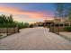 An exterior view of the home showcasing the long driveway and beautiful front yard landscaping at 5630 E Peak View Rd, Cave Creek, AZ 85331