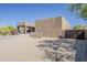 Southwestern-style home with gravel landscaping, mature plants, and a private gated entrance at 5630 E Peak View Rd, Cave Creek, AZ 85331