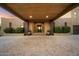 The beautiful home entrance with a covered entry, beautiful planters, and a paved driveway at 5630 E Peak View Rd, Cave Creek, AZ 85331