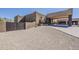 Attractive Southwestern home featuring manicured landscaping and a long driveway leading to a porte cochere at 5630 E Peak View Rd, Cave Creek, AZ 85331