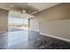 Open garage featuring polished concrete floors and an automatic door leading to a brick paved driveway at 5630 E Peak View Rd, Cave Creek, AZ 85331