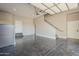 Spacious garage featuring polished concrete floors and ample storage space, and interior access at 5630 E Peak View Rd, Cave Creek, AZ 85331