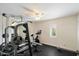 Well-equipped home gym featuring a weight rack, stationary bike, and rubber flooring at 5630 E Peak View Rd, Cave Creek, AZ 85331